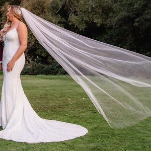 Unaltered size 12 wedding dress. Beaded and lace worn once and dry cleaned